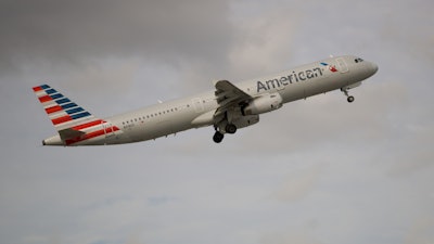 In this Thursday, Nov. 29, 2018, photo, an American Airlines Airbus A321 takes off from Fort Lauderdale-Hollywood International Airport.