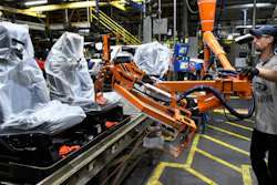 In this Oct. 27, 2017, photo, workers assemble trucks at the Ford Kentucky Truck Plant in Louisville.