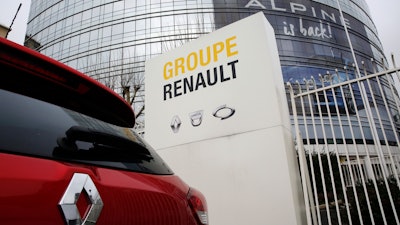 This photo, taken Thursday, Jan. 24, 2019, shows a Renault car outside the French carmaker's headquarters in Boulogne-Billancourt.