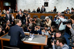 In this April 10, 2018, file photo, Facebook CEO Mark Zuckerberg returns from a break as he testifies before a joint hearing of the Commerce and Judiciary Committees on Capitol Hill.