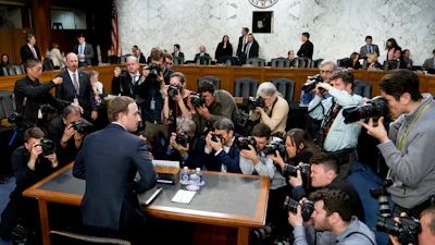 In this April 10, 2018, file photo, Facebook CEO Mark Zuckerberg returns from a break as he testifies before a joint hearing of the Commerce and Judiciary Committees on Capitol Hill.