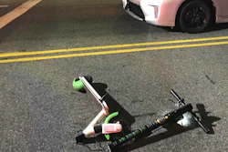 In this Dec. 23, 2018, photo provided by Jodi Robinson, a scooter Andrew Hardy was riding sits near the car that hit him in Los Angeles.