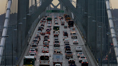 In this Dec. 10, 2015, file photo, vehicles make their way westbound across Bay Bridge in San Francisco.
