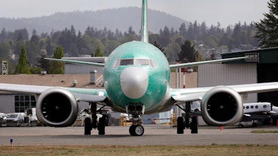 In this May 8, 2019, photo, a Boeing 737 Max 8 makes a turn on the runway in Renton, Wash.
