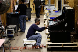In this Oct. 18, 2018, file photo, workers build refrigerators at the Howard McCray's commercial refrigeration manufacturing facility in Philadelphia.