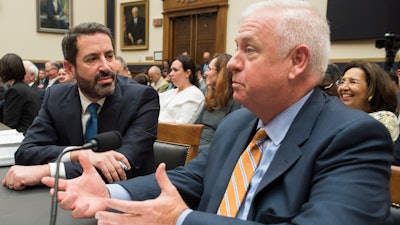 Kevin Riley, editor of the Atlanta Journal-Constitution, right, talks with David Pitofsky, General Counsel of News Corp., during their appearance before the House Judiciary Antitrust subcommittee, Tuesday, June 11, 2019.