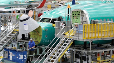 In this March 27, 2019, file photo, a Boeing 737 MAX 8 airplane is shown on the assembly line during a brief media tour of Boeing's 737 assembly facility in Renton, Wash.