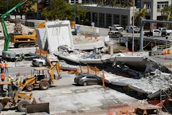 In this March 16, 2018, file photo, crushed cars are shown under a section of a collapsed pedestrian bridge near Florida International University.