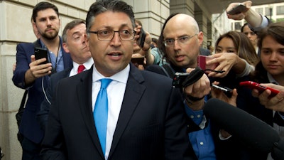 In this Tuesday, June 12, 2018, file photo, Assistant Attorney General for Antitrust Makan Delrahim leaves the federal courthouse in Washington.