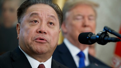 In this Nov. 2, 2017, file photo, Broadcom CEO Hock Tan speaks at an event in the White House.