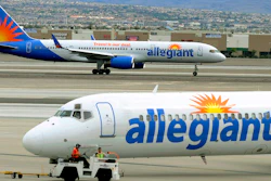 In this May 9, 2013, file photo, two Allegiant Air jets taxi at McCarran International Airport in Las Vegas.