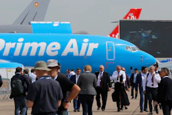 Visitors walk past a Boeing 737-800 BCF Amazon 'Prime Air' cargo plane at the Paris Air Show, Tuesday, June 18, 2019.