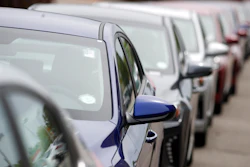 In this May 19, 2019, file photo, a long line of unsold 2019 sedans sits at a dealership in Littleton, Colo.