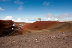 In this Aug. 31, 2015, file photo, observatories and telescopes sit atop Mauna Kea.