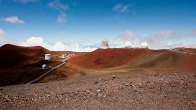 In this Aug. 31, 2015, file photo, observatories and telescopes sit atop Mauna Kea.