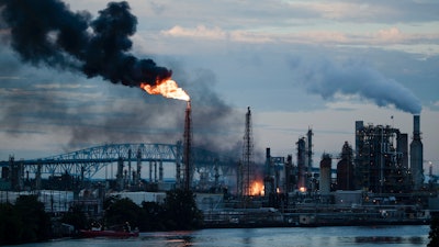 In this June 21, 2019, file photo, flames and smoke emerge from the Philadelphia Energy Solutions Refining Complex in Philadelphia.