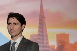 In this Feb. 8, 2018, photo, Canadian Prime Minister Justin Trudeau waits to speak at the AppDirect office in San Francisco.
