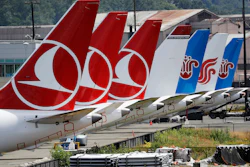The tails of several grounded Boeing 737 Max airplanes line the edge of a parking area adjacent to Boeing Field, Thursday, June 27, 2019, in Seattle.