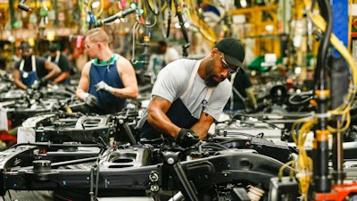 Employees work on the assembly line Tuesday, June 25, 2019, at the GM Arlington Assembly Plant in Arlington, Texas.