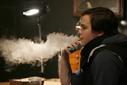In this March 15, 2017, photo, Becca Blackwell vapes after taking a lunch break in the Future Vapor store in Seattle.