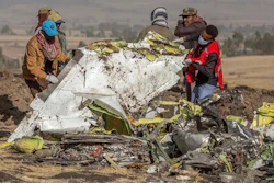 Clearing away the wreckage after a Boeing 737 Max aircraft crashed near Addis Ababa.