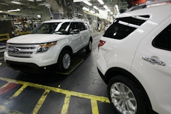In this Dec. 1, 2010, file photo, plant employees drive 2011 Ford Explorer vehicles off the assembly line at Ford's Chicago Assembly Plant.