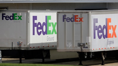 FedEx trailers are shown at a loading dock in Greensboro, N.C., Tuesday, June 25, 2019. FedEx is suing the United States government over export rules it says are virtually impossible to follow because it handles millions of packages a day.