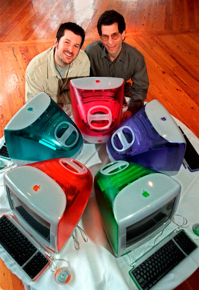 This March 19, 1999 file photo shows Jonathan Ive, left, Apple Computer's vice president of design, and Jon Rubinstein, Apple's senior vice president of engineering, posing behind five iMac personal computers at Apple headquarters in Cupertino, Calif. On Thursday, June 27, 2019, Apple said that Ive, chief design officer, will be leaving after more than two decades at the company to start his own firm.