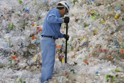 In this June 18, 2019, photo, a plastic recycling company worker sorts out plastic bottles collected for processing at Tokyo Petbottle Recycle Co., Ltd, in Tokyo. Japan has a plastic problem. Single bananas here are sometimes wrapped in plastic. So are individual pieces of vegetables, fruit, pastries, pens and cosmetics. Plastic-wrapped plastic spoons come with every ice cream cup. But as world leaders descend on Osaka for the two-day G20 Summit that starts Friday, June 28, Japan has ambitions to become a world leader in reducing plastic waste.