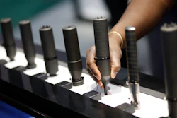 In this Jan. 19, 2016 file photo, gun silencers are on display at the Sig Sauer booth at the Shooting, Hunting and Outdoor Trade Show in Las Vegas. Gun silencers like the one used in a recent lethal shooting in Virginia Beach would be banned under legislation that U.S. Sen. Bob Menendez of New Jersey introduced Friday, June 21, 2019.