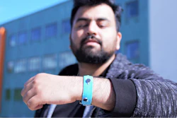 Co-creator Muhammad Umair wearing one of the prototype smart materials wrist bands.
