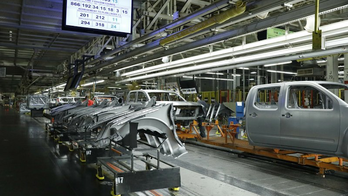 In this March 19, 2018, file photo, truck chassis roll down an assembly line at Nissan's Canton, Miss., assembly plant.
