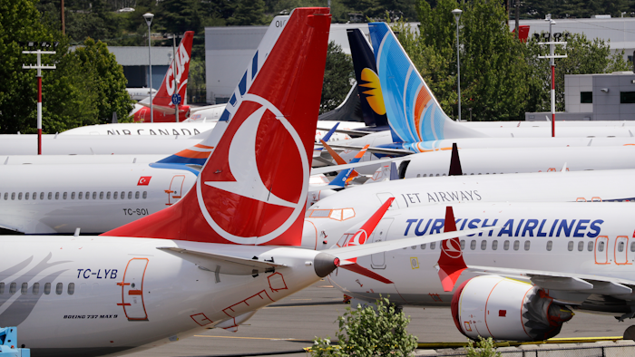 In this June 27, 2019, file photo, dozens of grounded Boeing 737 Max airplanes parked adjacent to Boeing Field in Seattle.