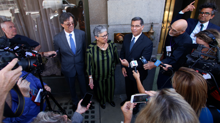 In this Sept. 24, 2018, file photo, from left, Cal/EPA Secretary Matthew Rodriguez, California Air Resources Board Chair Mary Nichols and California Attorney General Xavier Becerra talk to the media in Fresno, Calif.