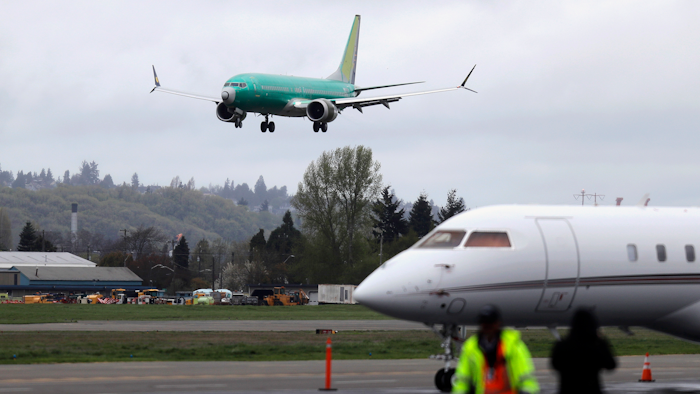 In this April 10, 2019, file photo, a Boeing 737 MAX 8 airplane lands following a test flight in Seattle.