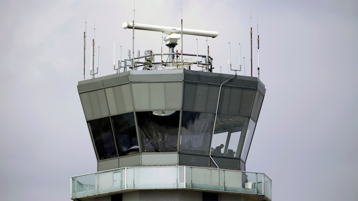 This March 12, 2013 photo shows the air traffic control tower at Chicago's Midway International Airport. The Department of Homeland Security plans to issue a security alert Tuesday for small planes, warning that modern flight systems are vulnerable to hacking if someone manages to gain physical access to the aircraft. A DHS alert recommends that plane owners ensure they restrict unauthorized physical access to their aircraft until the industry develops safeguards to address the issue, which was discovered by Boston-based cybersecurity company, Rapid7, and reported to the federal government.