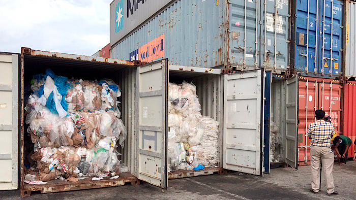 In this Tuesday, July 16, 2019, photo, containers loaded with plastic waste are placed at country beach city, Sihanoukville Port, southwest of Phnom Penh, Cambodia. A Cambodia's committee to investigate the sources of the trash discovered packing in more than 80 containers at country beach city, Sihanoukville Port, is needing seven to ten days to conclude their investigative, an official said Wednesday, July 17, 2019.