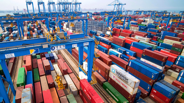 In this Tuesday, May 14, 2019, photo, containers are piled up at a port in Qingdao in east China's Shandong province. China's imports from the United States plunged 31.4% in June from a year earlier amid a tariff war with Washington, while exports to the U.S. market sank 7.8%, Customs data showed Friday, July 12, 2019.