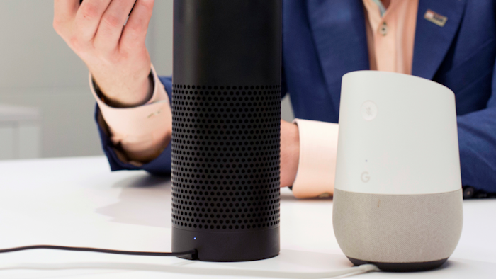 In this June 14, 2018, photo, an Amazon Echo, center, and a Google Home, right, are displayed in New York. Google contractors are listening to some recordings of people talking to Assistant, either on their phone or through smart speakers such as the Google Home. The company says some of its Dutch language recordings were leaked and that it is investigating.