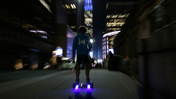 In this Oct. 21, 2015 file photo, a young man rides a hoverboard along a Manhattan street toward the Empire State Building, in New York. A Tennessee family's lawsuit against online retailer Amazon over a hoverboard fire that destroyed their home can move forward. The 6th U.S. Circuit Court of Appeals in a Friday, July 9, 2019, ruling said Amazon was aware of complaints about hoverboards catching fire and exploding. The Seattle-based company even launched an investigation that led to its ceasing all hoverboard sales worldwide.