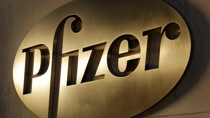 In this Nov. 23, 2015, file photo, the Pfizer logo is displayed at world headquarters in New York. Pfizer is buying Mylan in an all-stock deal and combining the generic pharmaceutical company with its off-patent branded and generic established medicines business.
