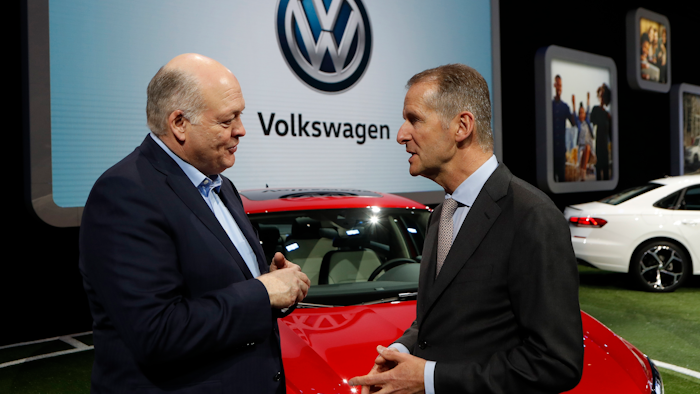 In this Jan. 14, 2019, file photo Ford Motor Co. President and CEO, Jim Hackett, left, meets with Dr. Herbert Diess, CEO of Volkswagen AG, at the North American International Auto Show in Detroit. Ford and Volkswagen are planning to unveil details about their budding alliance to build mobility services and autonomous and electric vehicles. Executives from both companies are planning to reveal details Friday, July 12.
