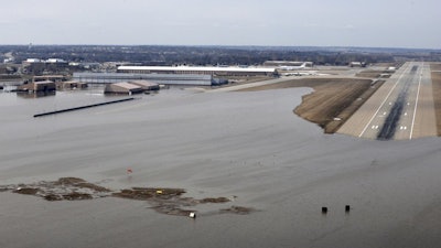 This March 17, 2019, file photo shows Offutt Air Force Base and surrounding areas in Nebraska affected by flood waters.