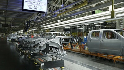 In this March 19, 2018, file photo, truck chassis roll down an assembly line at Nissan's Canton, Miss., assembly plant.