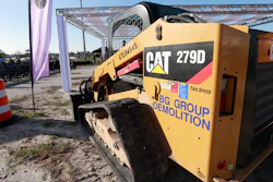 In this May 8, 2019 photo, a Caterpillar 279D Compact Track Loader sits at a demolition site in Fort Lauderdale, Fla.