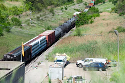 A freight train that derailed in an international tunnel connecting Michigan and Canada, sits on the track, Friday, June 28, 2019, in Port Huron, Mich.