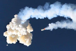 The Orion test capsule, bottom left, and a Minotaur 4 booster rocket, center, fall to the Earth, Tuesday, July 2, 2019.
