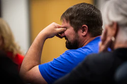 A man reacts after a Blackjewel employee mentions not being able to deposit the cashiers check he received from the company during a public meeting at the Campbell County Courthouse in Gillette, Wyo., Tuesday afternoon, July 2, 2019.