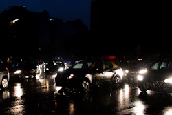 In this June 16, 2019, file photo, cars drive through an unlit street during a blackout in Buenos Aires.
