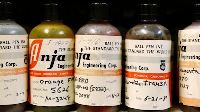In this June 27, 2019 photo, ink samples collected by former U.S. Secret Service chief chemist Antonio Cantu sit on a shelve in a newly-dedicated International Ink Library in remembrance of Cantu at the Secret Service headquarters building in Washington. The library contains more than 15,000 samples of pen, marker and printer inks dating back to the 1920s.